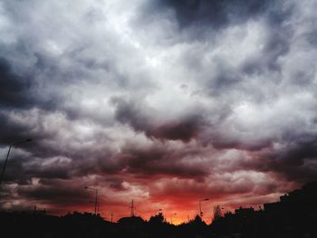 Low angle view of dramatic sky during sunset