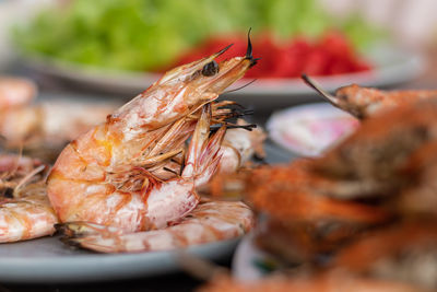 Close-up of grill prawn in plate on table