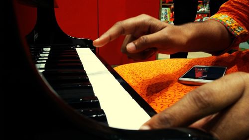 Close-up of man playing guitar