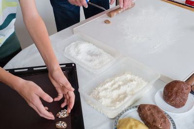 Father and son making christmas cookies