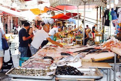 Group of people at market stall