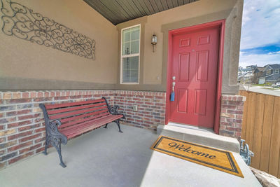 Empty benches against building