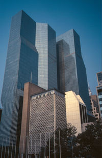 Low angle view of modern buildings against sky