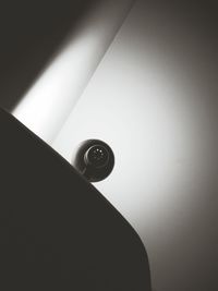 Low angle view of electric lamp on wall