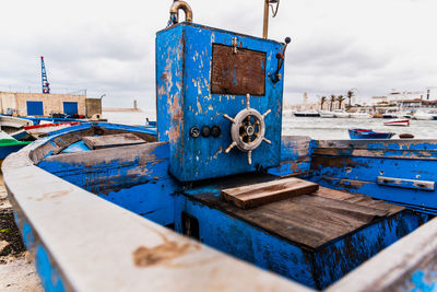 Old rusty pier against blue sky