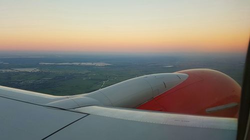 Cropped image of airplane flying over sea