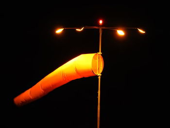 Low angle view of illuminated street light against sky at night