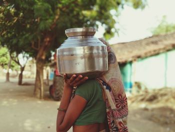 Rear view of woman standing outdoors