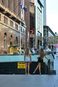 Woman standing on city street