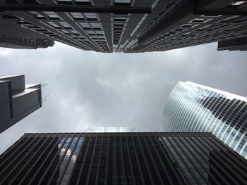 Low angle view of modern buildings against sky in city