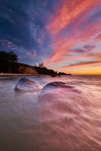 Scenic view of sea against sky during sunset