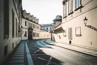 City street amidst buildings against sky