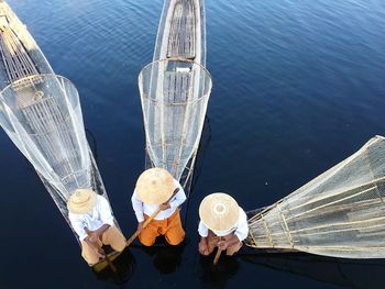 Directly above shot of fisherman on boats in sea