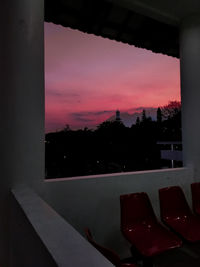 Silhouette built structure against sky at sunset