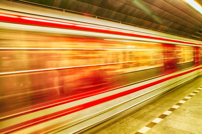 Blurred motion of train at railroad station platform