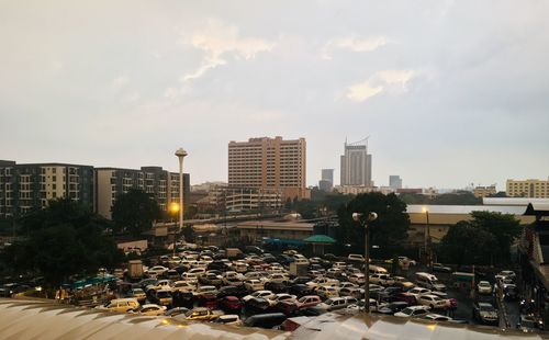 City street by buildings against sky