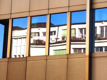 Reflection of building on glass window