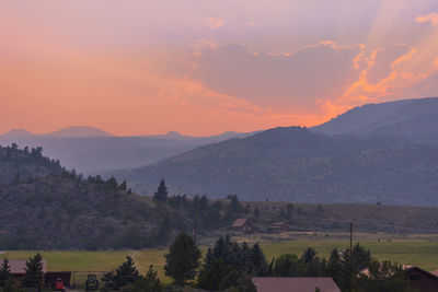 Scenic view of mountains against sky during sunset