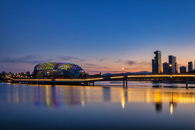 Illuminated city at sunset