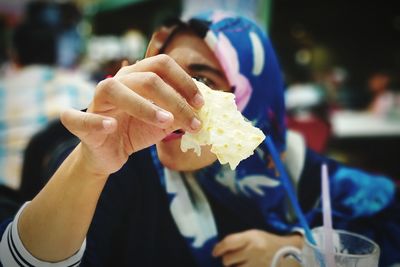 Close-up of hand holding ice cream