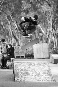 Men jumping in city