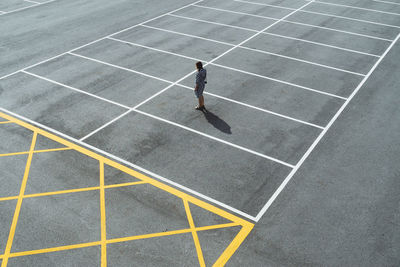 High angle view of woman at parking lot