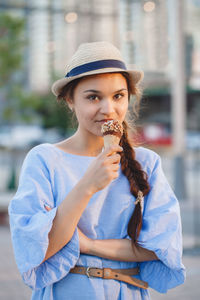 Portrait of woman eating ice cream