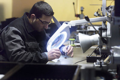 Man working in a sensor technology plant