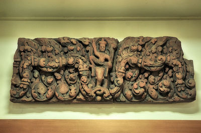 Close-up of statue on table in museum