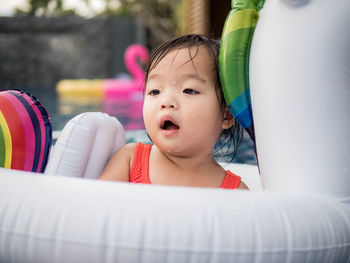 Cute girl enjoying in swimming pool