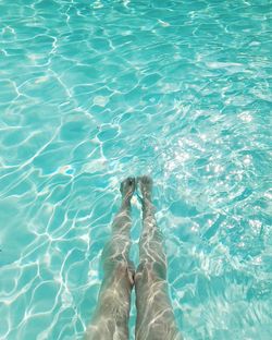 Low section of woman in swimming pool