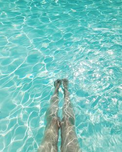 Low section of woman in swimming pool