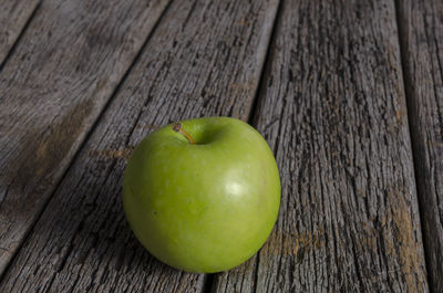 Close-up of apple on wooden table