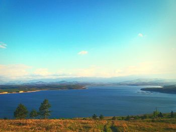 Scenic view of sea against clear blue sky