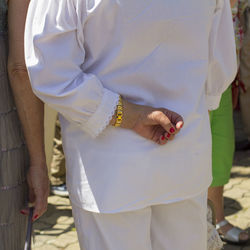 Midsection of couple standing in traditional clothing