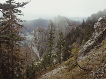 Scenic view of mountains in foggy weather