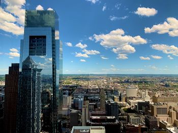 Modern buildings in city against sky