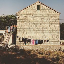 Clothes drying against built structure