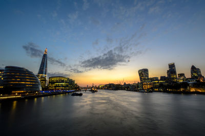 Modern city lit up at dusk