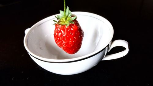 High angle view of strawberries in plate on table