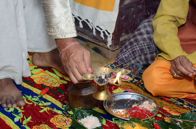 Midsection of man holding hands