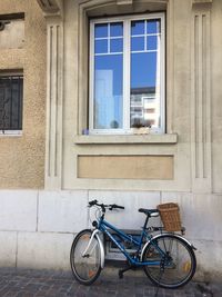 Bicycle parked in front of building