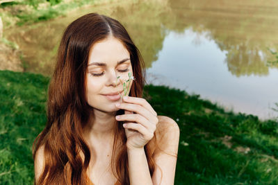 Portrait of young woman looking away