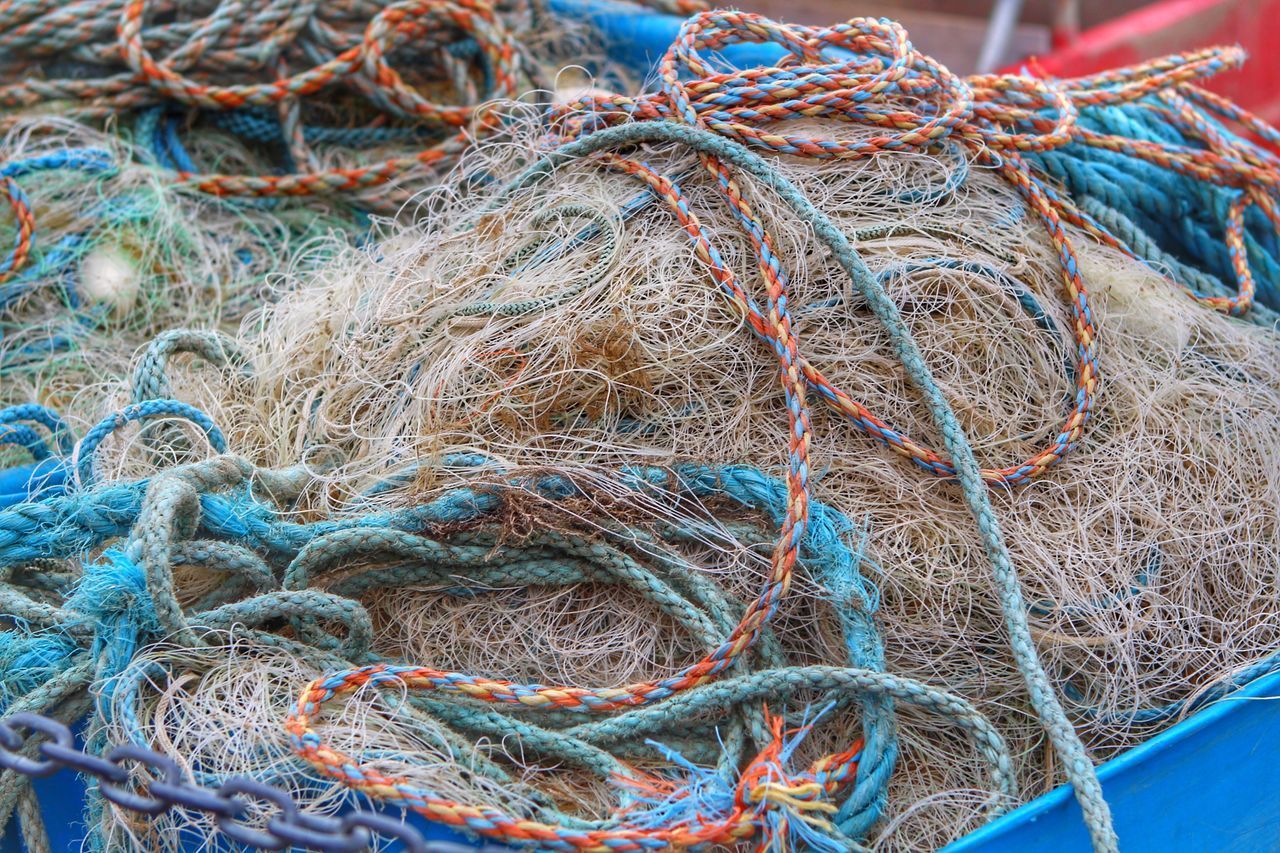 CLOSE-UP OF FISHING NET WITH ROPE