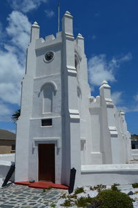 Low angle view of white building against sky