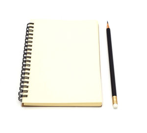 High angle view of pen on paper against white background
