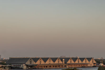 View of houses against sky during sunset