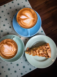 High angle view of cappuccino served on table