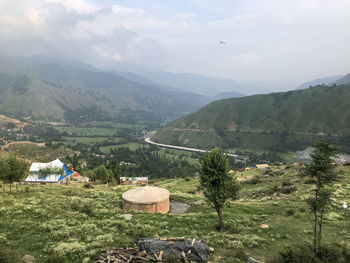 Scenic view of landscape and mountains against sky