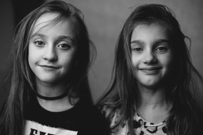 Portrait of smiling girls with long hair